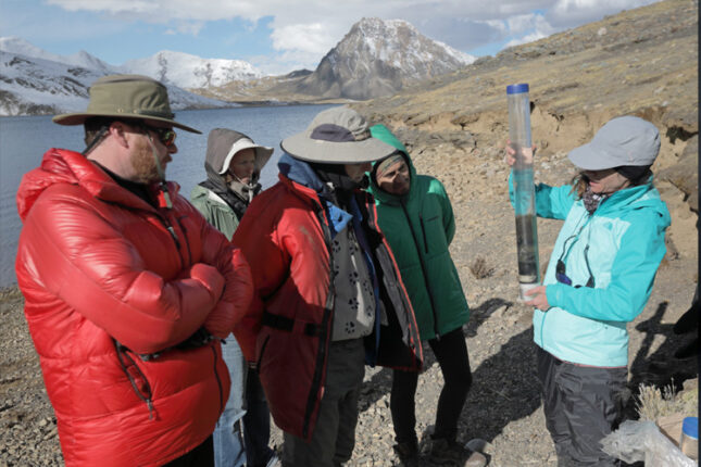 researchers examine sample taken from high altitude lake in the Peruvian Andes
