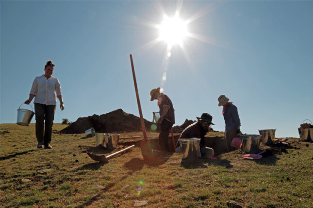 Elissa A Bullion and undergraduates at grave site dig
